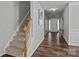 Welcoming entryway featuring wood floors, a staircase, and natural light from the front door at 3908 Parkers Ferry Rd, Fort Mill, SC 29715