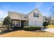 Inviting two-story home with a two-car garage, covered porch, and manicured shrubs on a sunny day at 3908 Parkers Ferry Rd, Fort Mill, SC 29715