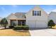 Charming two-story home with a two car garage, well maintained lawn, and manicured bushes at 3908 Parkers Ferry Rd, Fort Mill, SC 29715