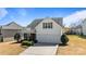 Charming two-story home with a two car garage, well maintained lawn, and manicured bushes at 3908 Parkers Ferry Rd, Fort Mill, SC 29715