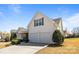 Charming two-story home with a two car garage, well maintained lawn, and manicured bushes at 3908 Parkers Ferry Rd, Fort Mill, SC 29715