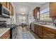 Well-lit kitchen featuring wood cabinets, modern appliances, and an adjacent dining area with plenty of natural light at 3908 Parkers Ferry Rd, Fort Mill, SC 29715