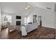 Bright living room with a fireplace, vaulted ceilings, plush seating, and dark wood floors at 3908 Parkers Ferry Rd, Fort Mill, SC 29715