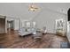 Bright living room with vaulted ceilings, plush seating, and dark wood floors at 3908 Parkers Ferry Rd, Fort Mill, SC 29715