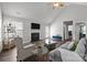 Bright living room with a fireplace, vaulted ceilings, plush seating, and dark wood floors at 3908 Parkers Ferry Rd, Fort Mill, SC 29715