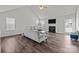 Bright living room with a fireplace, vaulted ceilings, plush seating, and dark wood floors at 3908 Parkers Ferry Rd, Fort Mill, SC 29715