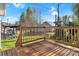 Sunny wooden deck with railings offering outdoor living space and backyard view at 4 Short St, Belmont, NC 28012