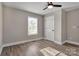 Bright bedroom featuring a ceiling fan, wood-look floors, and a window for ample natural light at 4 Short St, Belmont, NC 28012