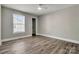 This bedroom features wood floors, a ceiling fan, and a window at 4 Short St, Belmont, NC 28012