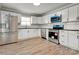 A bright kitchen featuring modern appliances, sleek countertops, and ample cabinet space at 4 Short St, Belmont, NC 28012