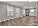 Inviting living room features modern finishes, wood floors, and lots of natural light at 4 Short St, Belmont, NC 28012