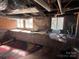 Unfinished basement area featuring stone walls, support beams and windows at 406 E Earnhardt St, Salisbury, NC 28144