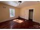 Sunny bedroom featuring hardwood floors and a view of the outdoors at 406 E Earnhardt St, Salisbury, NC 28144