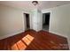 This cozy bedroom offers natural light and hardwood floors and multiple closets at 406 E Earnhardt St, Salisbury, NC 28144