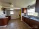 Cozy kitchen with a double basin sink, tile flooring and wooden cabinets for ample storage at 406 E Earnhardt St, Salisbury, NC 28144