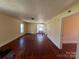 The spacious living room has natural light, wood floors and connects to other rooms at 406 E Earnhardt St, Salisbury, NC 28144