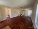 A bright living room featuring wood floors and ample natural light at 406 E Earnhardt St, Salisbury, NC 28144