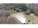 Aerial view of property featuring a large pond, surrounding trees and several outbuildings at 4229 Motocross Trl, Edgemoor, SC 29712