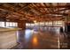 Large event space with exposed beam ceilings, wood accents, and table seating at 4229 Motocross Trl, Edgemoor, SC 29712