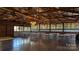 Bright event space with exposed rafters, chandeliers, and table seating at 4229 Motocross Trl, Edgemoor, SC 29712