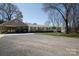 Inviting single-story home with a charming porch, well-kept landscaping, and an extended driveway for ample parking at 4229 Motocross Trl, Edgemoor, SC 29712