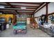 Spacious garage interior with ATV, motorcycles, and metal shelving at 4229 Motocross Trl, Edgemoor, SC 29712
