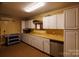 Utility kitchen featuring ample cabinets, counter space, and dishwasher at 4229 Motocross Trl, Edgemoor, SC 29712