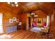 Spacious living room features wood paneled walls, a chandelier, and comfortable seating at 4229 Motocross Trl, Edgemoor, SC 29712