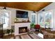 Inviting living room featuring a fireplace, mounted television and plenty of natural light at 4229 Motocross Trl, Edgemoor, SC 29712