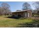 Outbuilding with sign over the door and a covered outdoor area at 4229 Motocross Trl, Edgemoor, SC 29712