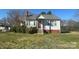 Charming home with a cozy front porch and well-maintained lawn at 514 W Blume St, Landis, NC 28088