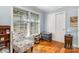 Comfortable bedroom with hardwood floors, a sunny window, and ample closet space at 5215 Milford Rd, Charlotte, NC 28210