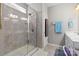 Well-lit bathroom featuring a glass-enclosed shower with tiled walls, plus modern fixtures and vanity at 5827 Eleanor Rigby Rd, Charlotte, NC 28278