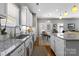 Bright kitchen with granite countertops, stainless steel appliances and an eat-in dining area at 5827 Eleanor Rigby Rd, Charlotte, NC 28278
