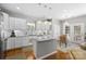 Well-lit kitchen with granite countertops, stainless steel appliances, and a kitchen island at 5827 Eleanor Rigby Rd, Charlotte, NC 28278