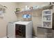 Functional laundry room with shelving and modern washer and dryer at 5827 Eleanor Rigby Rd, Charlotte, NC 28278