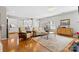 Bright, open-concept living room featuring hardwood floors and ample natural light at 5827 Eleanor Rigby Rd, Charlotte, NC 28278