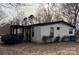 Charming single-story house with a covered front porch and simple landscaping at 6552 Denver Heights Cir, Denver, NC 28037