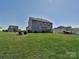 Expansive backyard with a gentle slope, offering plenty of space for outdoor activities and relaxation at 7240 Baybrooke Ln, Harrisburg, NC 28075