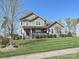 Charming two-story home boasts a well-manicured lawn, a porch, and classic curb appeal at 7240 Baybrooke Ln, Harrisburg, NC 28075