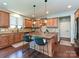 Spacious kitchen with custom cabinets, stainless steel appliances, granite countertops, and a functional island at 7240 Baybrooke Ln, Harrisburg, NC 28075