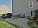 Cozy patio area with outdoor seating and a grill, perfect for enjoying outdoor meals and gatherings at 7240 Baybrooke Ln, Harrisburg, NC 28075