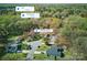 An aerial view shows the home near NoDa and Plaza Midwood, nestled in a leafy, residential area at 7656 Eastbourne Rd, Charlotte, NC 28227