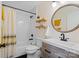 Bathroom features tub-shower combo, framed mirror, and modern vanity at 7656 Eastbourne Rd, Charlotte, NC 28227