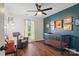 Dark accent wall in the Bedroom is nicely decorated with a black crib and other art at 7656 Eastbourne Rd, Charlotte, NC 28227