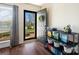Stylish entryway features dark hardwood floors, a modern console table, and a welcoming open door at 7656 Eastbourne Rd, Charlotte, NC 28227