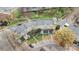 Aerial view of townhome community with manicured lawns and mature trees at 840 Garden District Dr, Charlotte, NC 28202