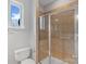 Bright bathroom showcasing a glass enclosed shower and a toilet at 840 Garden District Dr, Charlotte, NC 28202