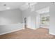 Spacious loft features a ceiling fan and large windows allowing for natural light at 840 Garden District Dr, Charlotte, NC 28202