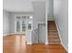 Staircase with carpeted steps, white railing and a bright window at 840 Garden District Dr, Charlotte, NC 28202